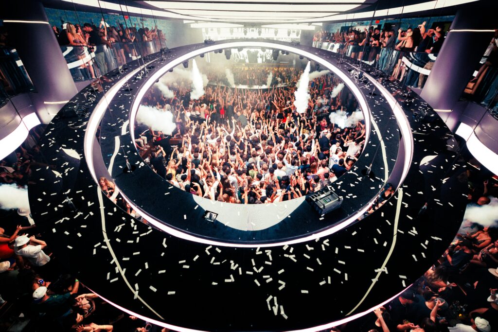 The LIV Las Vegas Halo above a packed crowd of people dancing.