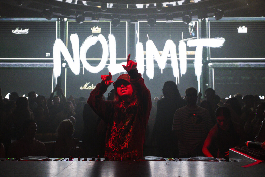 Knock2 performing at LIV Las Vegas with crowd and LED Nolimit backdrop.