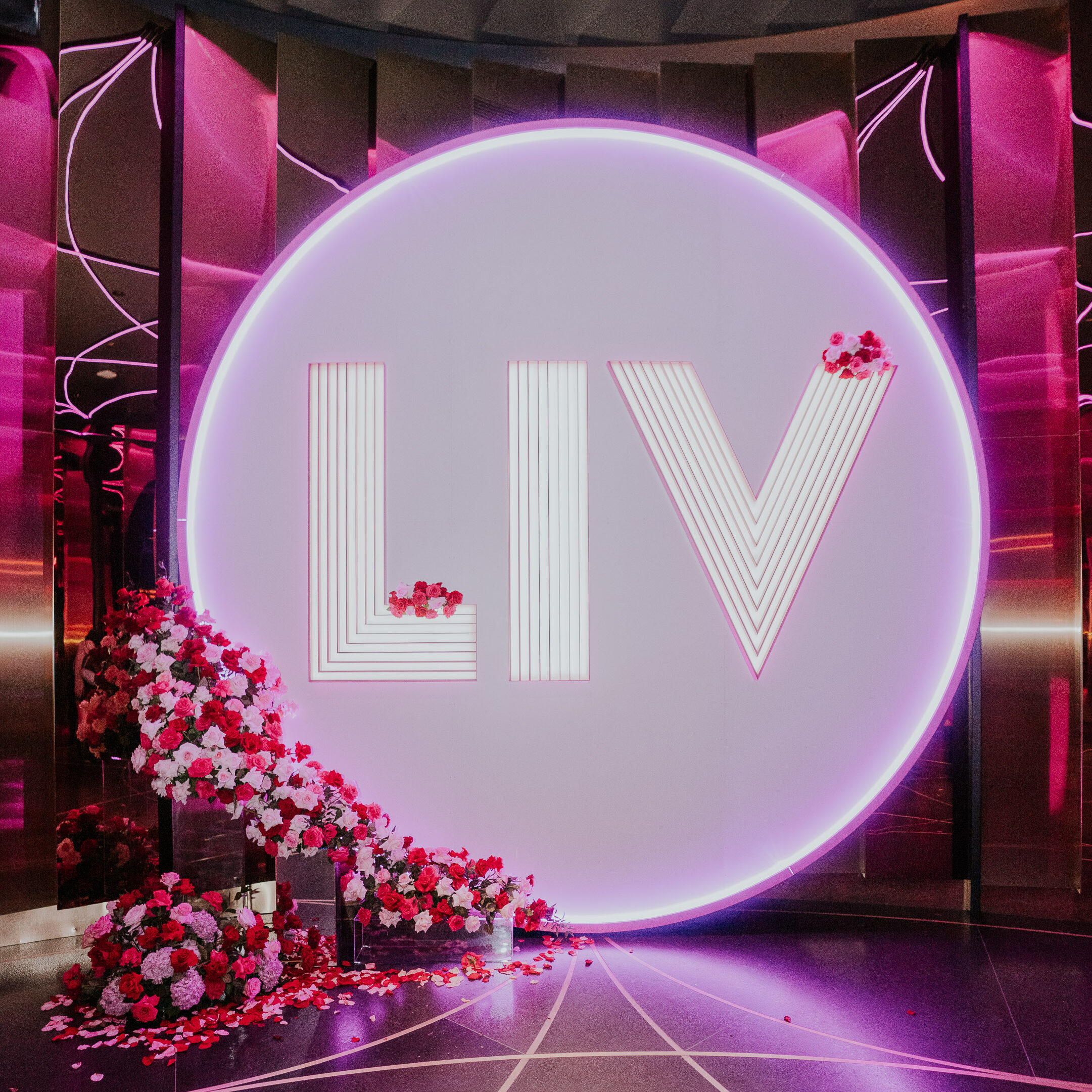 LIV Las Vegas sign decorated with roses.