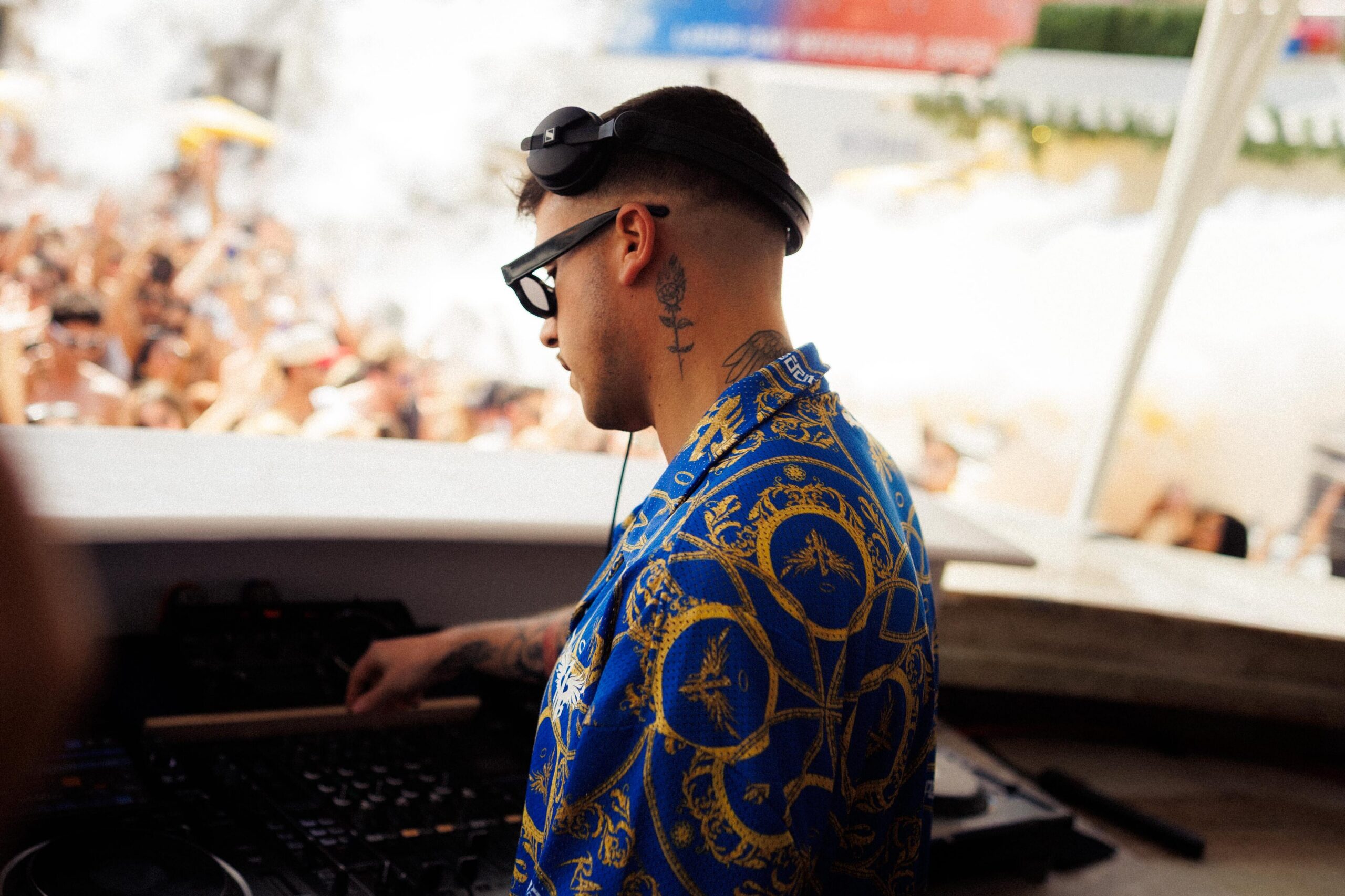 Matroda performing at LIV Beach with crowd surrounding the DJ booth during a daytime set.
