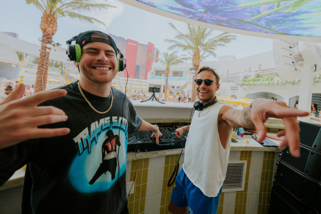 Sidepiece live at LIV Beach during a daytime set, engaging the crowd from the DJ booth.