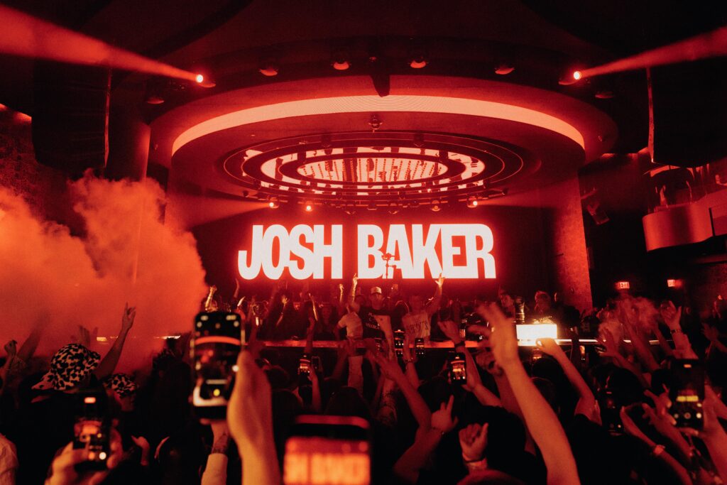 Josh Baker playing at LIV Las Vegas in front of a full crowd.