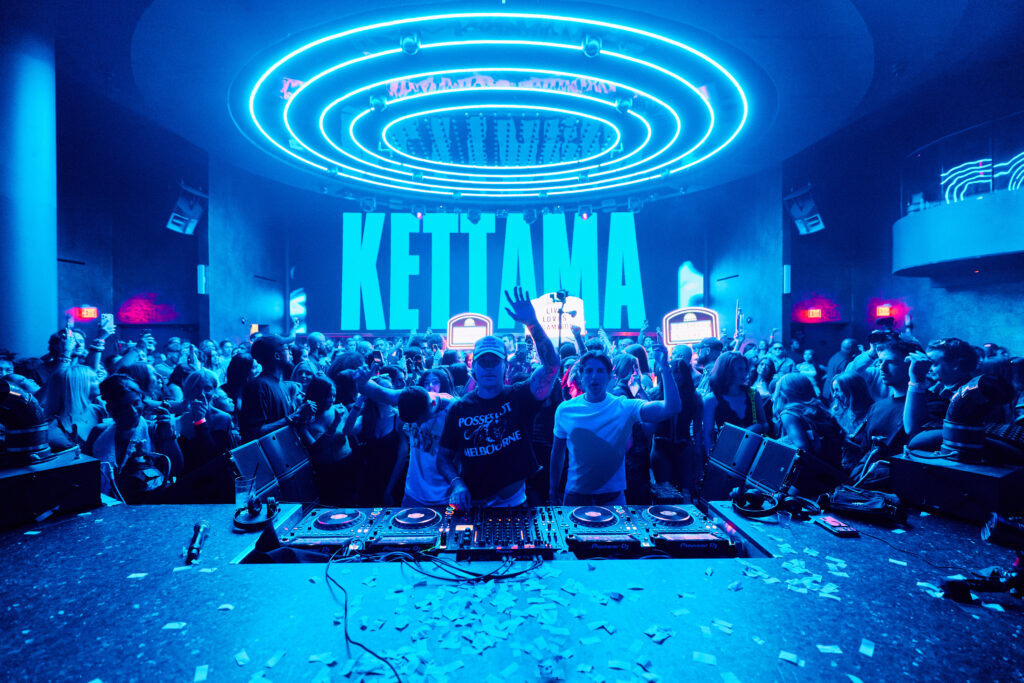 Kettama waving to the audience behind the DJ booth at LIV Las Vegas.