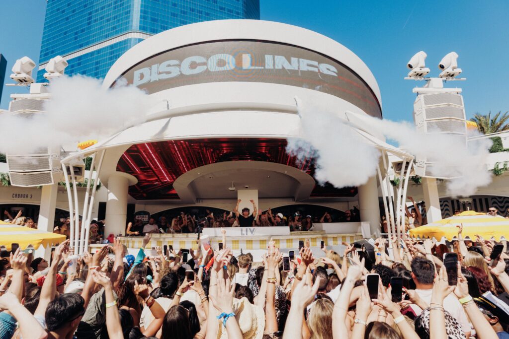 Disco Lines playing behind the DJ booth in front of a full crowd at LIV Beach.